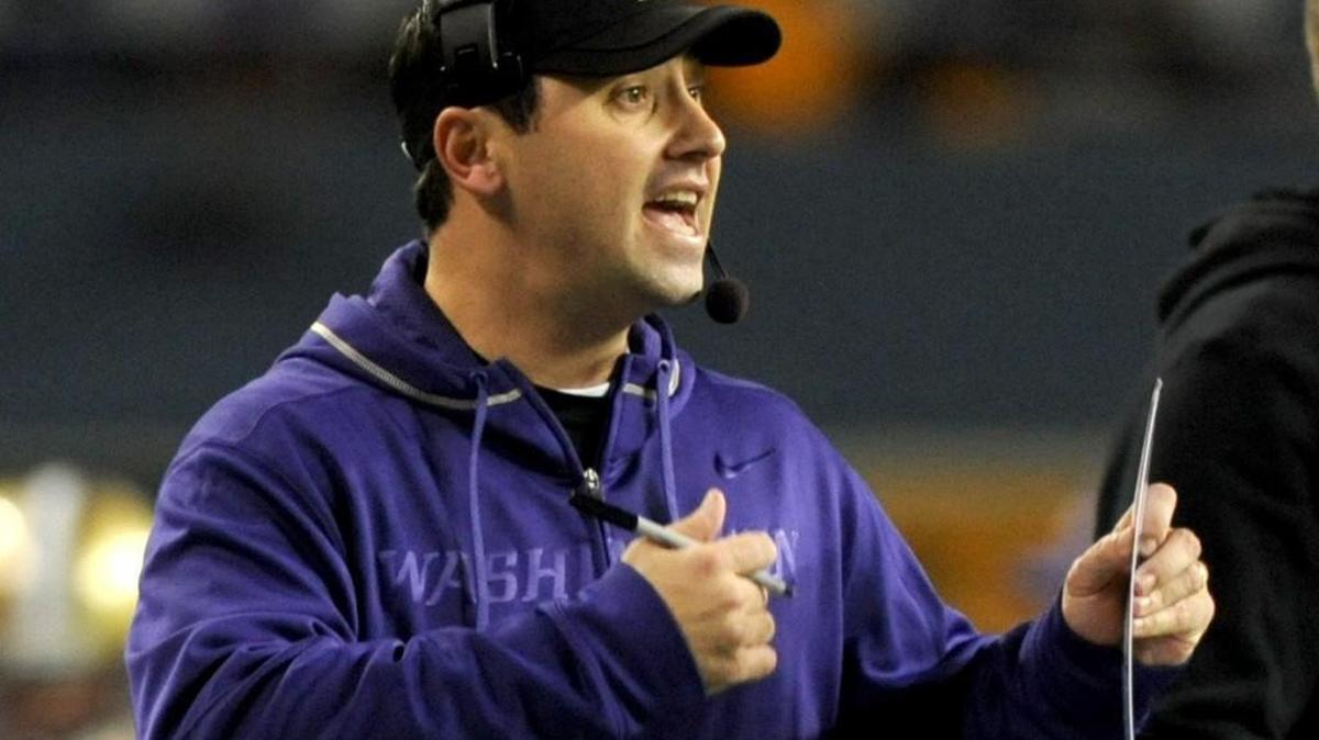 
Steve Sarkisian talks to his Washington Huskies team during the 2011 Apple Cup at CenturyLink Field in Seattle. Sarkisian was fired Monday as head coach at USC.
