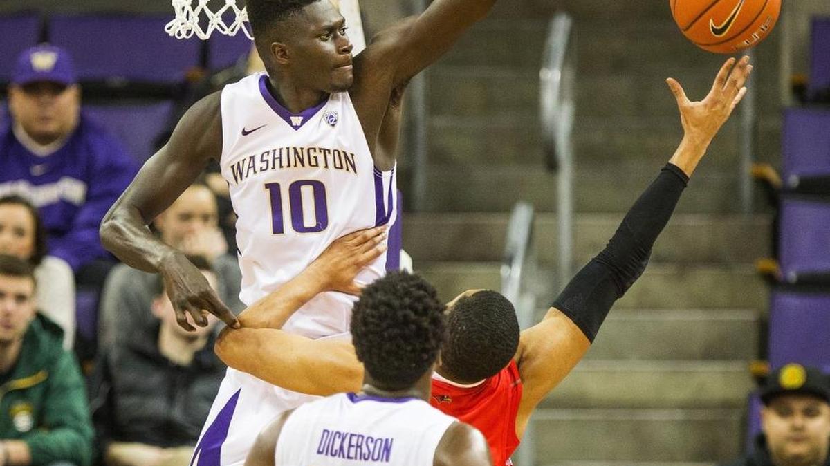 UW freshman Malik Dime (10) rises up for a blocked shot against Seattle University. Dime finished with five blocks.