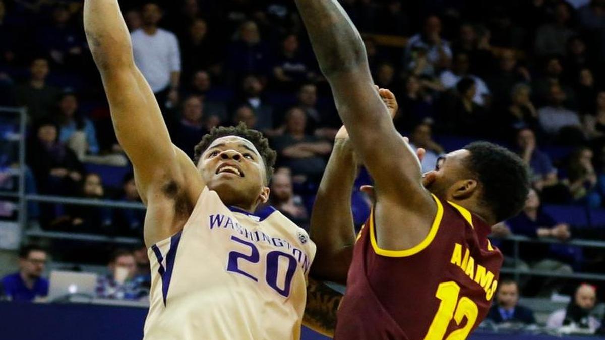 Washington guard Markelle Fultz (20) has a shot blocked by Arizona State forward Andre Adams (12) on Thursday. The Huskies lost, 83-81.