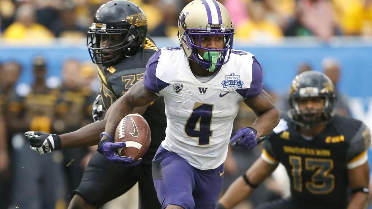 UW wide receiver Jaydon Mickens (4) takes the ball in for a touchdown against Southern Mississippi. Mickens led the Huskies with eight receptions for 95 yards.