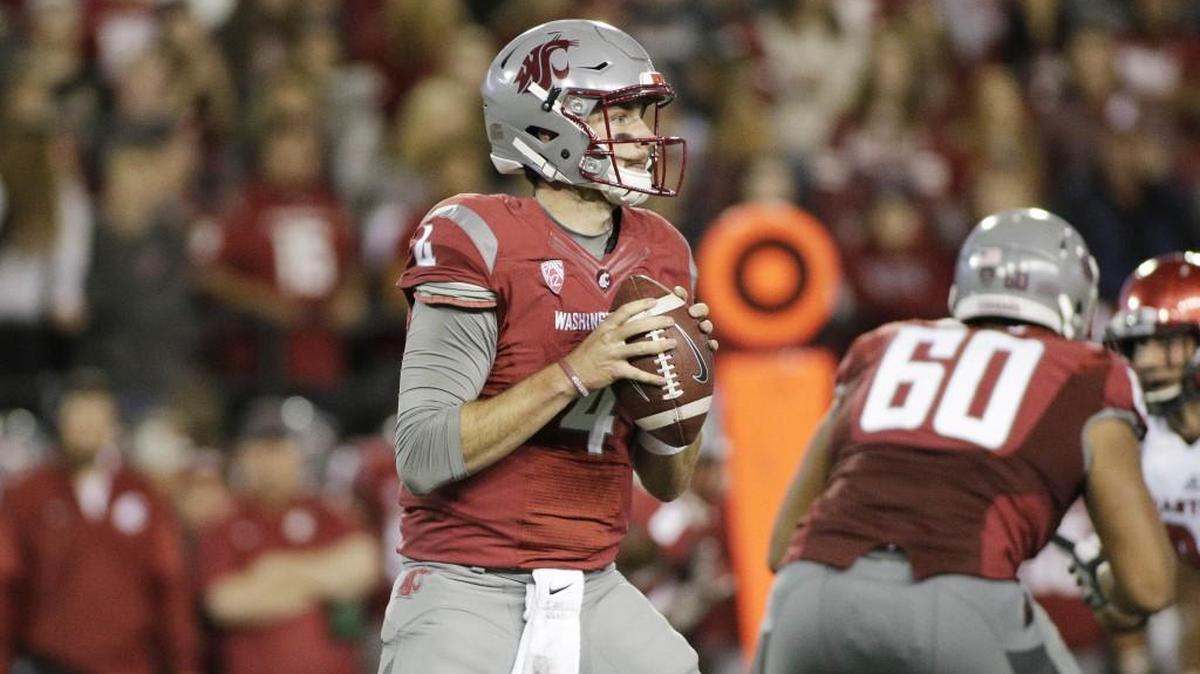 Washington State quarterback Luke Falk (4) was of 41 of 51 passing for 418 yards and four TDs with one interception against Eastern Washington this past Saturday. The Cougars lost 45-42 to the Eagles.