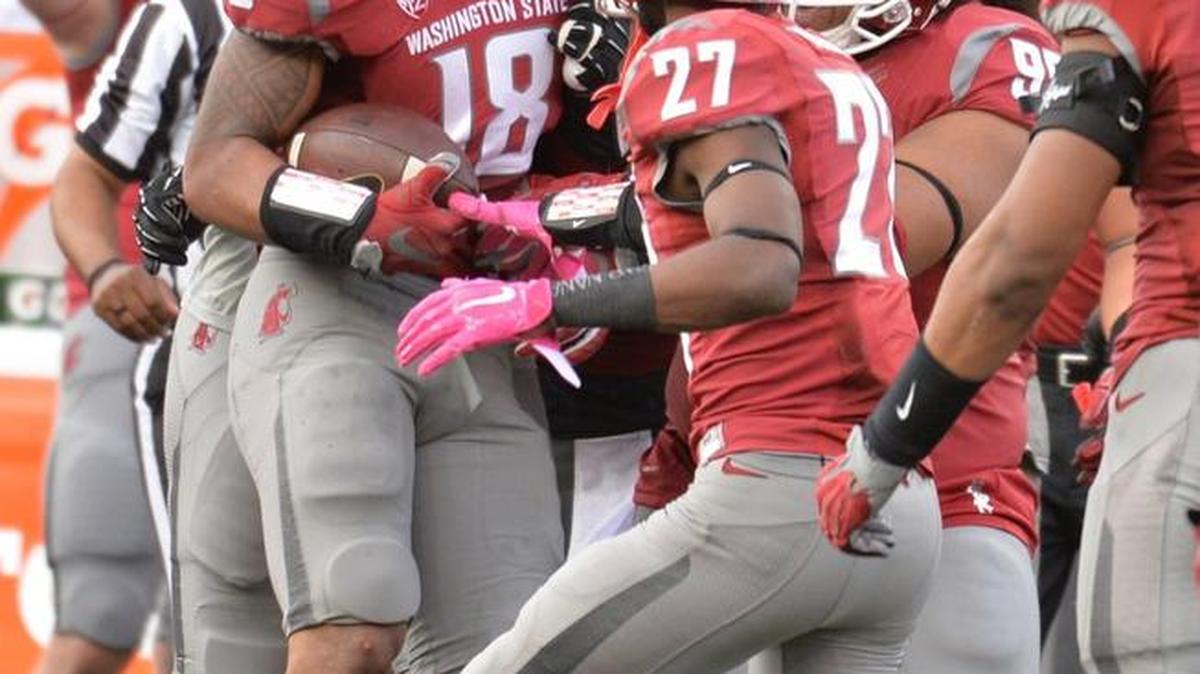 WSU coach Mike Leach says safety Shalom Luani (18) will play Saturday after sitting out last week’s game against Eastern Washington.