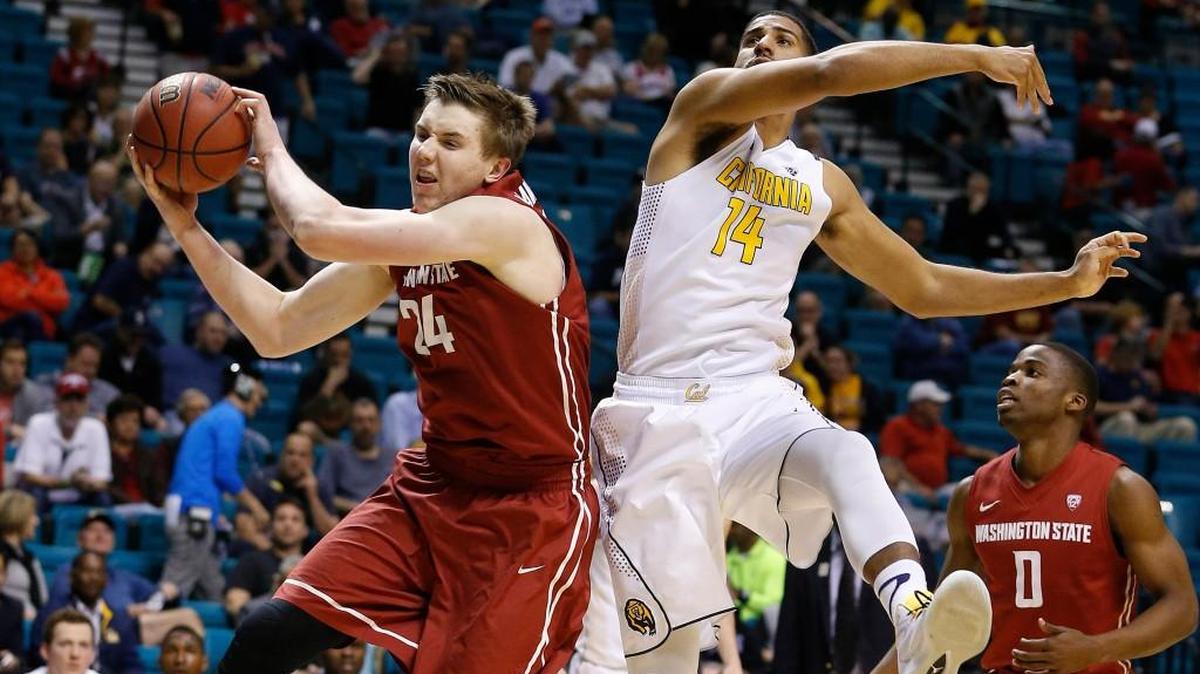 Washington State’s Josh Hawkinson, left, and California’s Christian Behrens battle for a rebound during the Pac-12 tournament in March. Hawkinson has increased his scoring from 14.7 to 18.0 points per game this season.