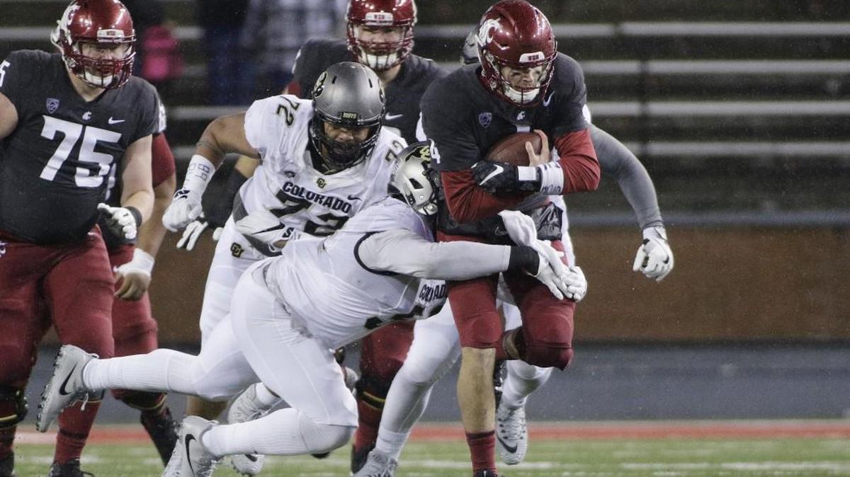 Colorado defensive end Leo Jackson III, takes down Washington State quarterback Luke Falk last week. It was part of the plan, given the weather, that Falk ran more vs. the Buffaloes.