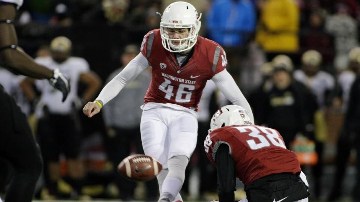 Washington State kicker Erik Powell (46) kicks a point after as Kaleb Fossum (38) holds during the second half against Colorado on Nov. 21, 2015, in Pullman, Wash.