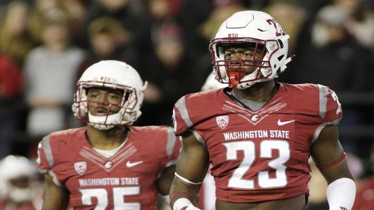 Washington State running back Gerard Wicks (23) and running back Jamal Morrow (25) run onto the field during the second half of an NCAA college football game against California in Pullman, Wash., Saturday, Nov. 12, 2016.
