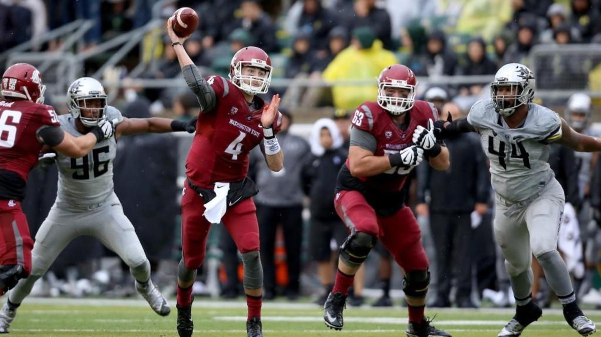 
Quarterback Luke Falk (4) led Washington State to a game-tying touchdown Saturday in the final two minutes at Oregon. The Cougars won 45-38 in double overtime.
