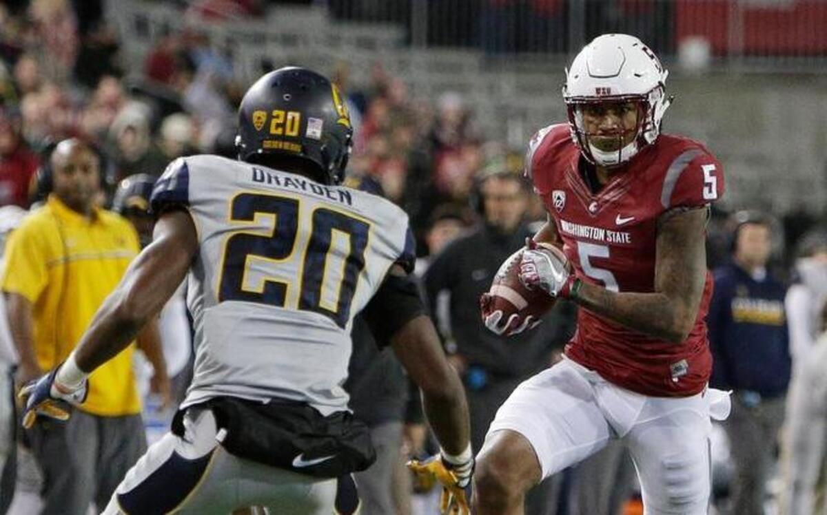 Washington State wide receiver Isaiah Johnson-Mack (5) runs with the ball while defended by California cornerback Josh Drayden (20) during the second half of an NCAA college football game in Pullman, Wash., Saturday, Nov. 12, 2016.