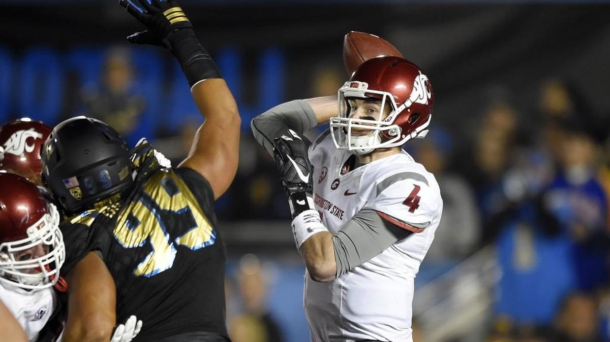 Washington State quarterback Luke Falk, right, is on the watch lists for most of college football’s major awards