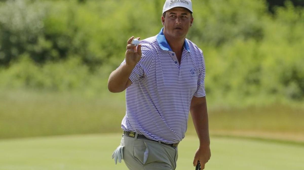 Michael Putnam reacts after making a putt on the third hole during the first round of the U.S. Open golf tournament Thursday.