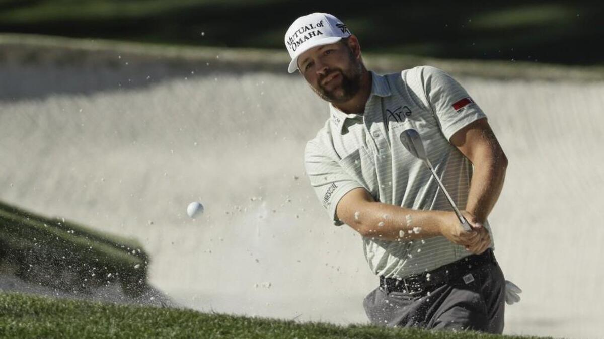 Ryan Moore hits from a bunker on the 10th hole during the third round of the Masters golf tournament. A shoulder injury kept him out of the U.S. Open last month.