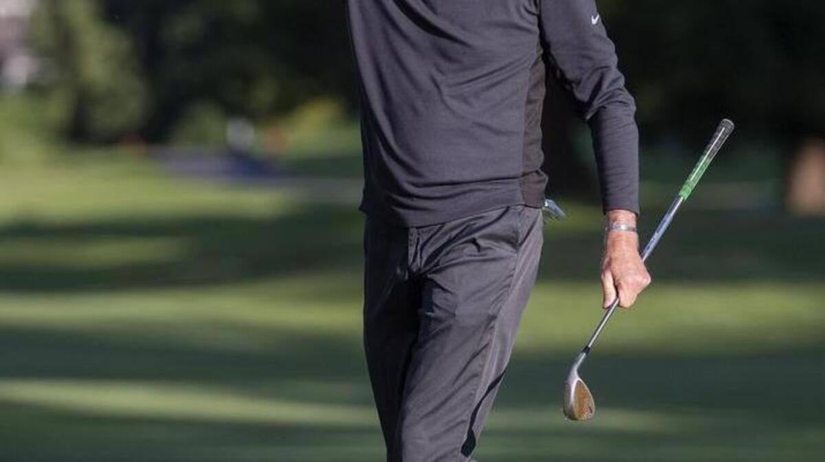 Jeff Coston pumps his fist after making a key chip onto the 18th green, leaving him a short birdie putt at the Washington Open Invitational at Meridian Valley Country Club in Kent on Wednesday.