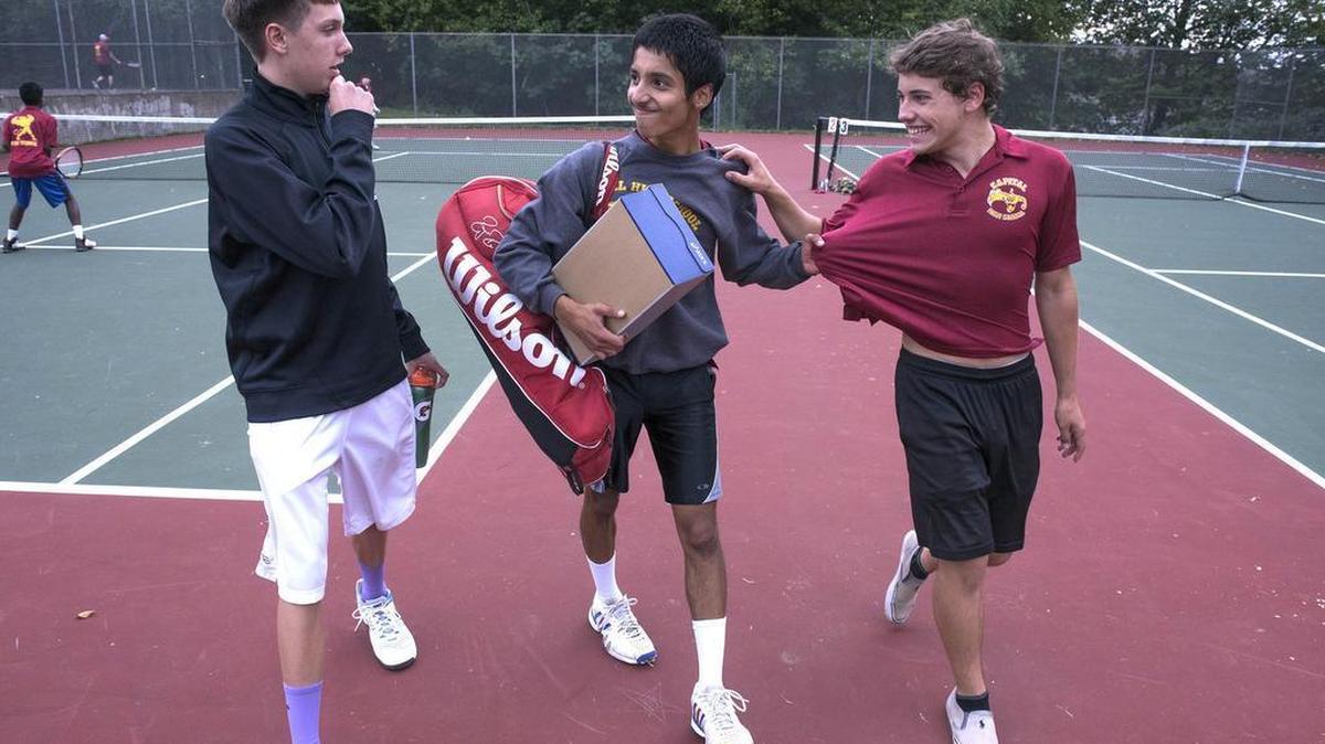 
Capital number one singles player Ranjan Sharangpani (center) jokes with number one doubles teammates Clint Tosland (left) and Matthew Monk following their boys tennis matches against North Thurston at Capital High School in Olympia on Tuesday, Oct. 6, 2015. Sharangpani won his match over North Thurston's Joonick Ahn, 6-4, 6-1. Tosland and Monk were defeated by North Thurston's Thomas Sui and Michael Campbell, 6-1, 6-0.
