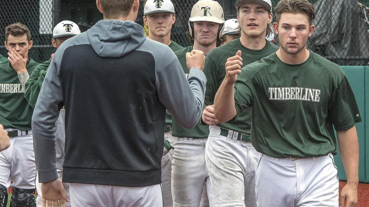 Timberline starter Austin Whalen, right, leads his teammates in congratulating Skyline’s players after the Spartans’ victory.
