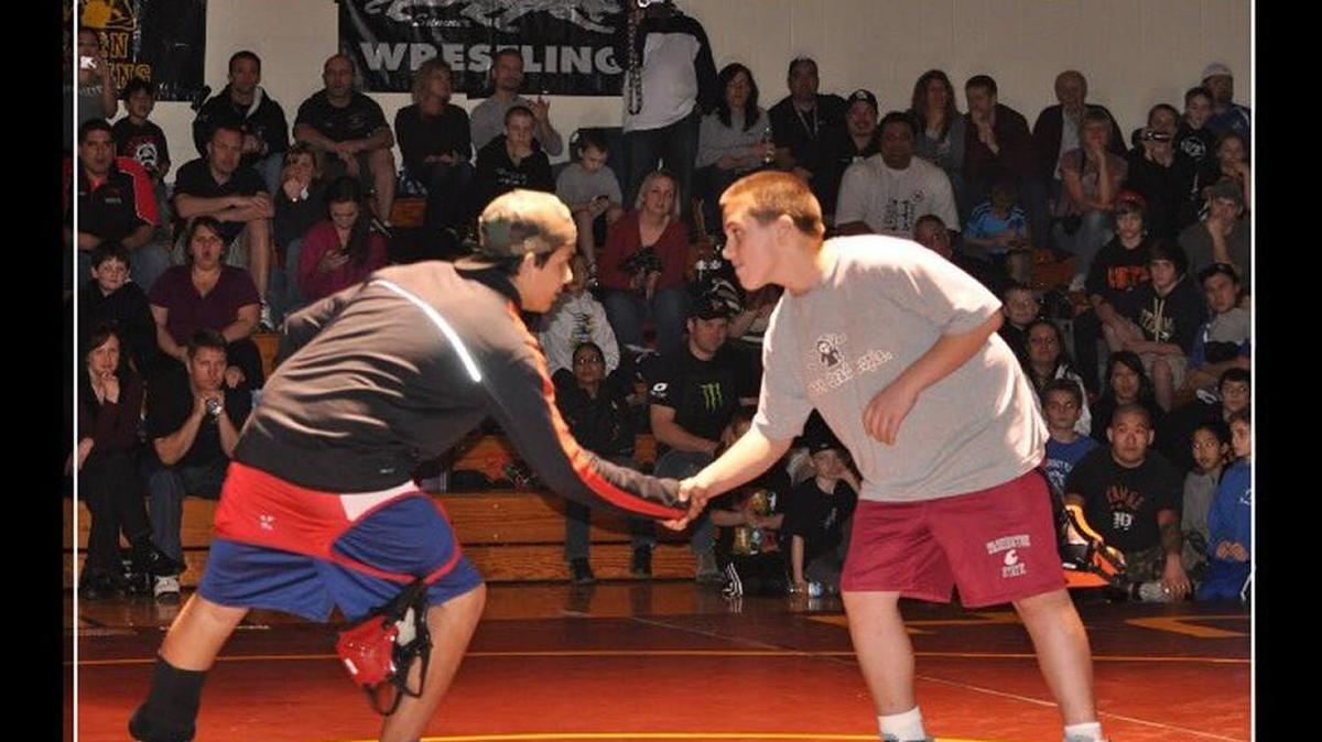 Cousins Hunter Mullins, left, and Cy Hicks prepare for their championship match in the 9-and-over 175-pound division at the 2011 Pierce County Junior Wrestling League tournament. Mullins is now a senior heavyweight at Orting, and Hicks is a sophomore heavyweight at Tumwater.