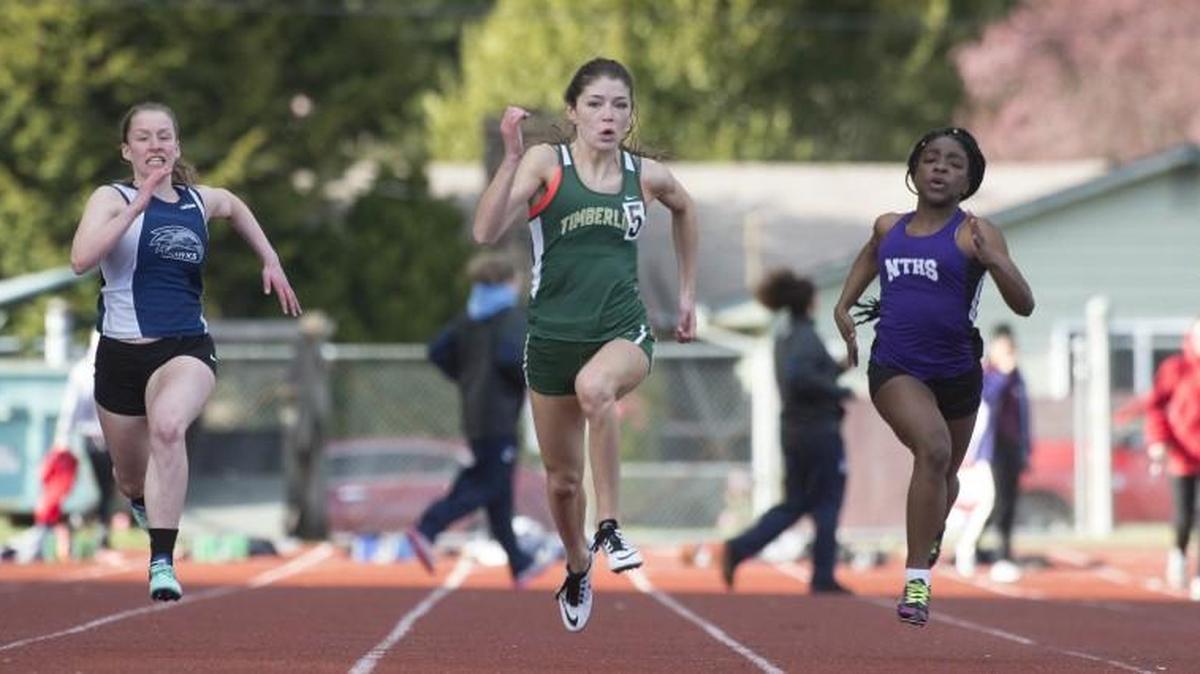 Timberline's Makenna Hansen (center) runs to victory in the girls 100-meter dash ahead of (from left) Tumwater's Codi Short, River Ridge's Taryn Lucas, North Thurston's Amesha Harris and Battleground's Elizabeth Kinnan at the Wolfpack Invitational Track & Field Meet at Tumwater District Stadium on Friday, April 14, 2017.