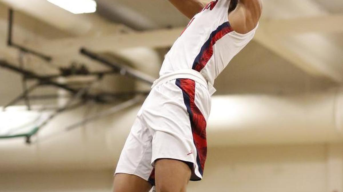 Wilson’s Emmitt Matthews Jr. throws down a breakaway dunk in the third quarter against North Thurston on Wednesday night. Matthews scored 13 points in the quarter and 25 overall.