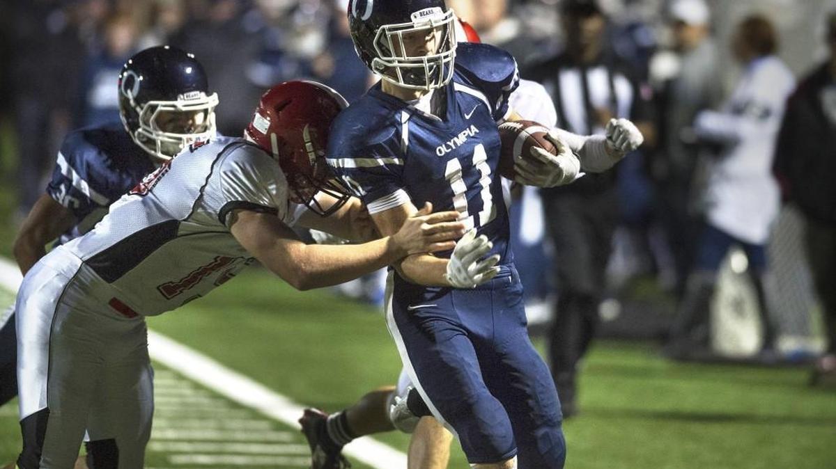 Olympia and David Woodward clinched a trip to the district playoffs Friday with a 35-9 win over Yelm at Ingersoll Stadium.