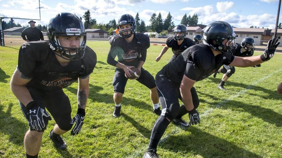 Rainier Zach Lofgren, center, scored five touchdowns last week against Chief Leschi.