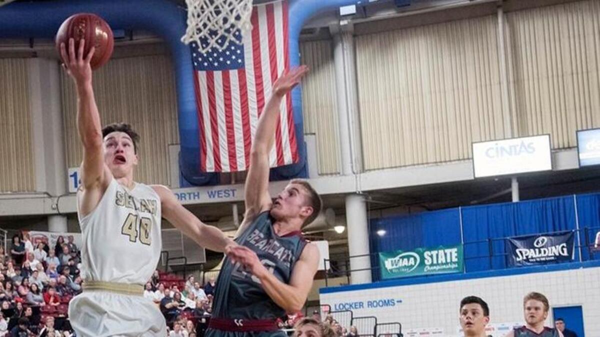 Selah’s Elijah Pepper flies to the basket in a 2A state quarterfinals game against W.F. West at the Yakima Valley SunDome on Thursday, March 1, 2018. The Bearcats upset the Vikings to advance to the semifinals.