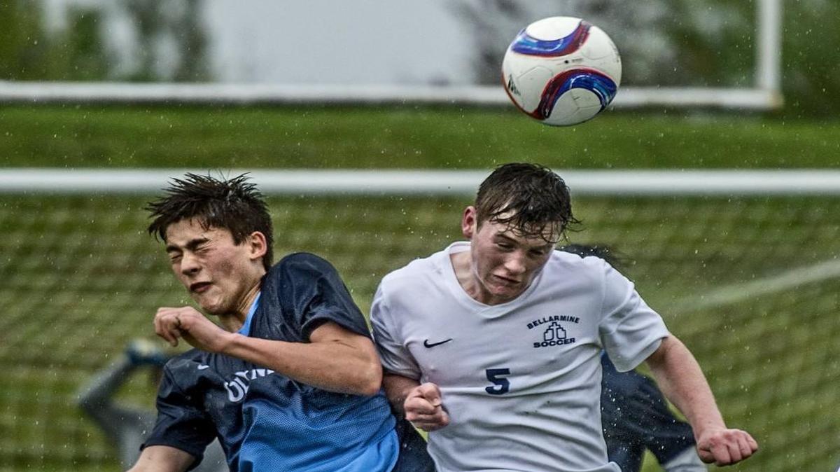 Olympia’s Mitchell Nee, left, and Bellarmine’s Roberty Numi battle for the ball in the air. Bellarmine scored three times in the first 22 minutes to pull away from Olympia for good.