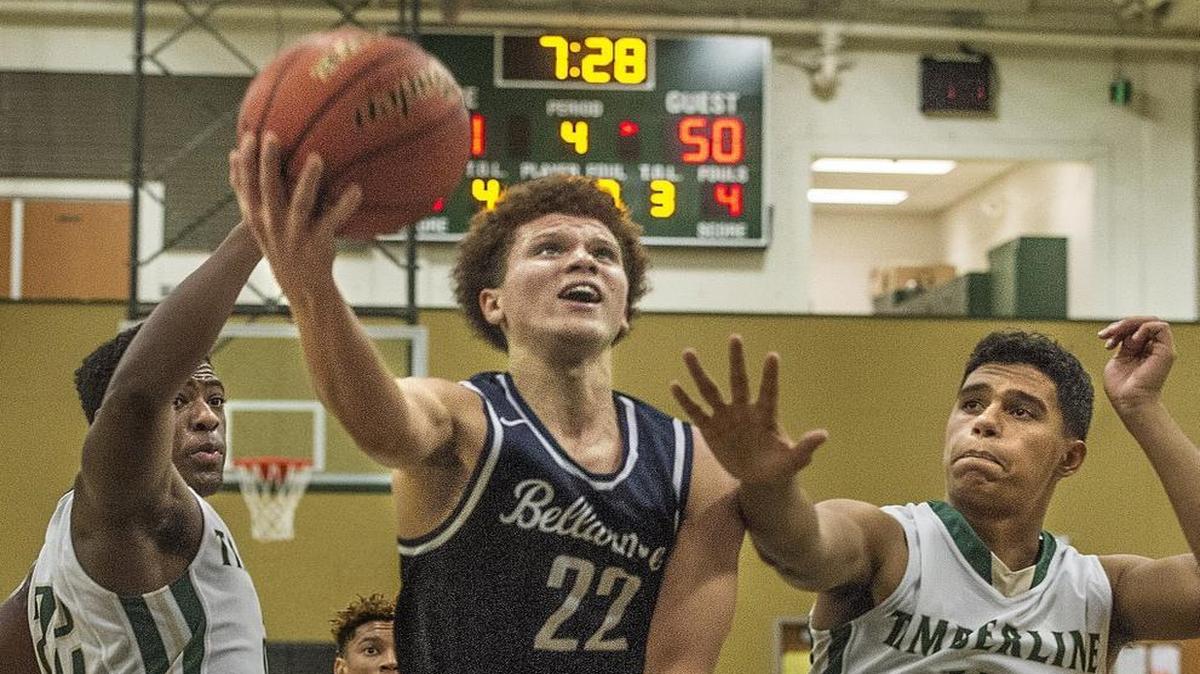 Bellarmine Prep’s Malachi Flynn splits Timberline defenders Jarry Bush, left, and Jaelen Bush to score Wednesday in Lacey. Flynn poured in 34 points in the victory.