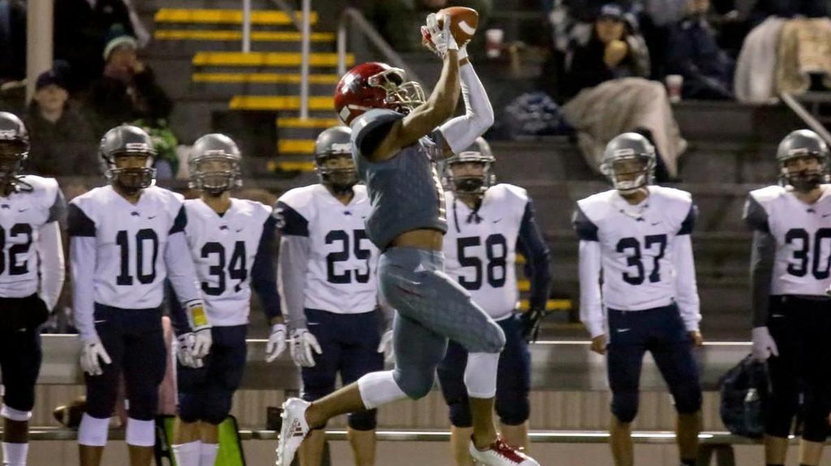 Archbishop Murphy's Kyler Gordon makes a catch near the River Ridge sideline Friday night at Goddard Stadium at Mariner High in Everett on Nov. 10, 2017.