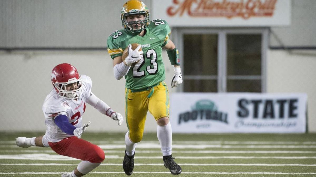 Tumwater’s Noah Andrews (23) breaks away from Prosser’s David Ledesma during the 2A title game at the Tacoma Doma last December. The T-Birds have won five state titles using the Wing-T.