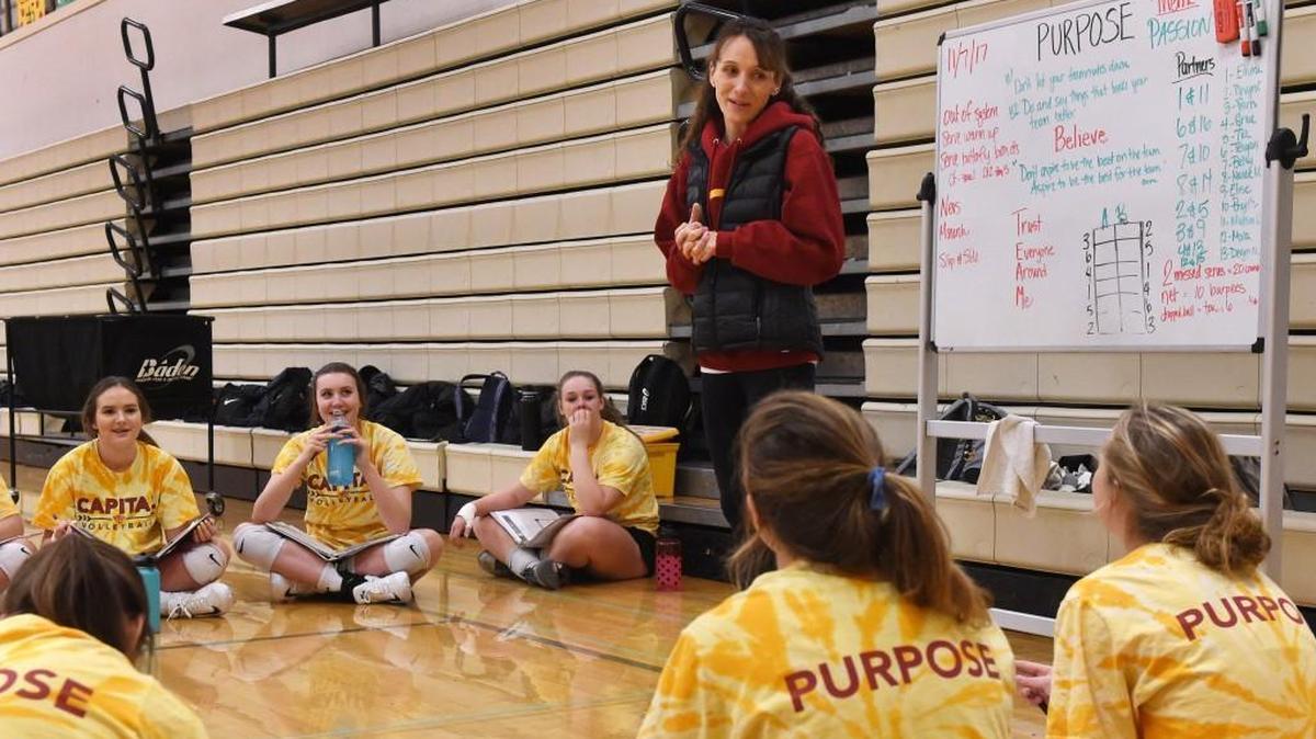 Capital High School volleyball coach Katie Turcotte holds one of her regular team meetings as the Cougars prepare for the 3A state playoffs at practice Tuesday, Nov. 7, 2017.