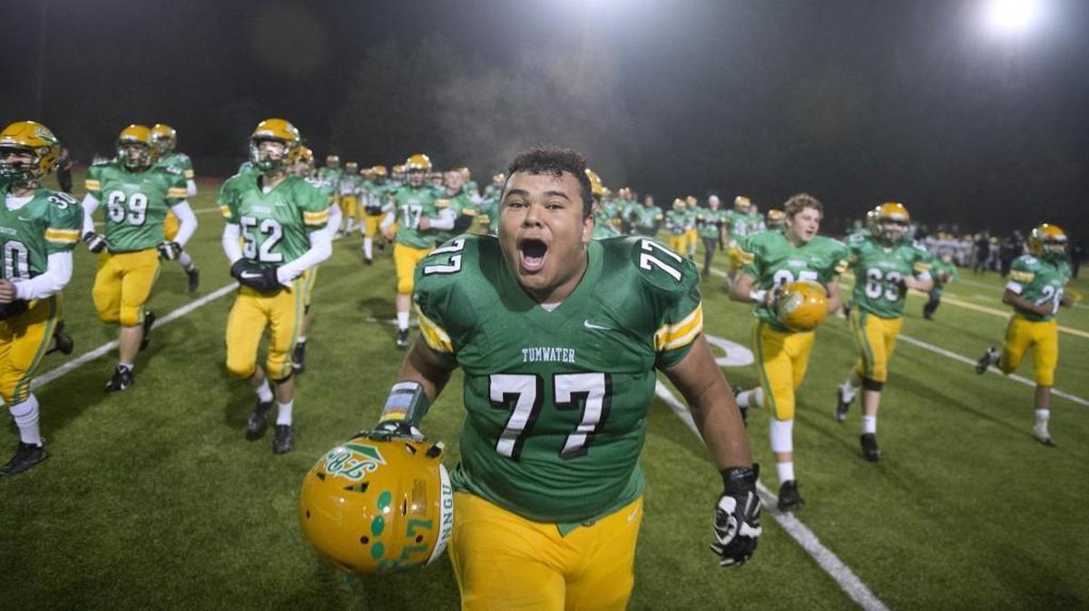 Tumwater senior lineman Spencer Monahan celebrates following the T-Birds' 23-21 victory over Lynden in Friday night's opening-round game of the 2A state football playoffs at Tumwater District Stadium on Nov. 9, 2017.