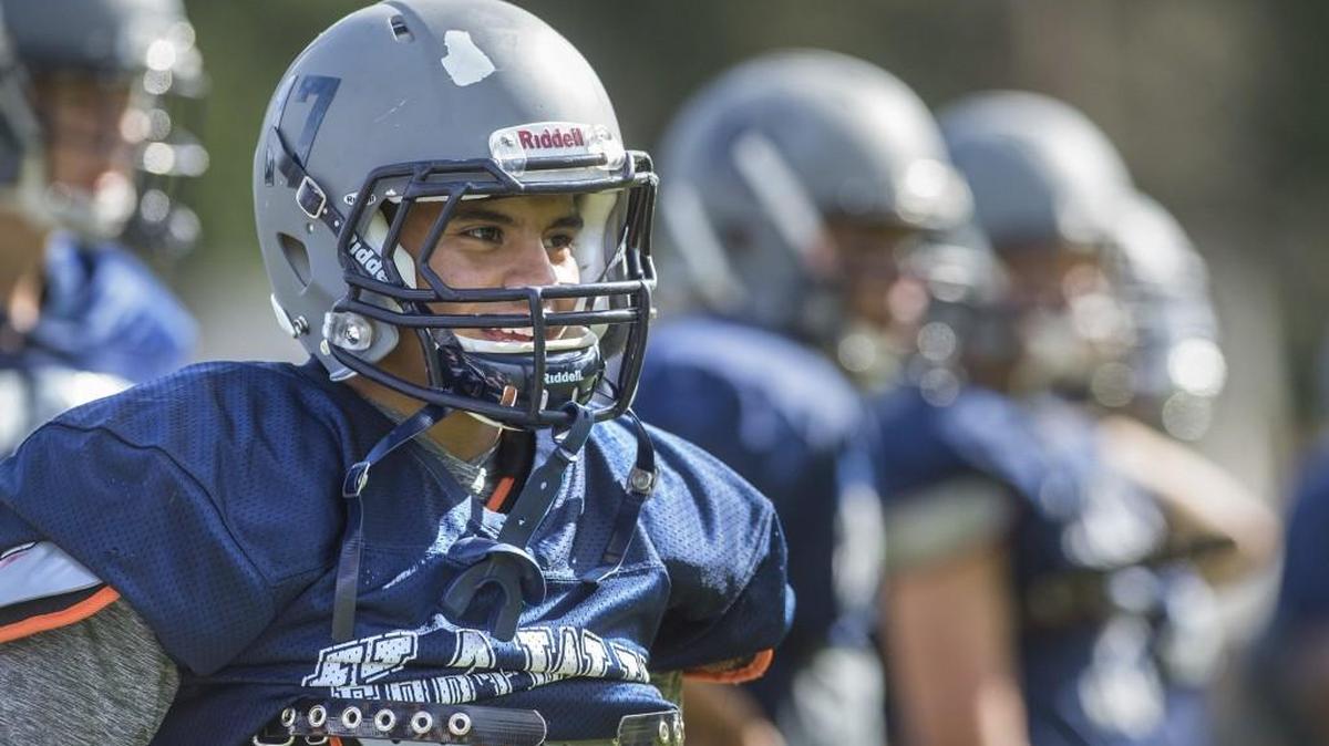 
River Ridge High School senior Gustavo Diaz plays running back for the Hawks when he’s not busy being a father to his 7-month-old son, Julian.
