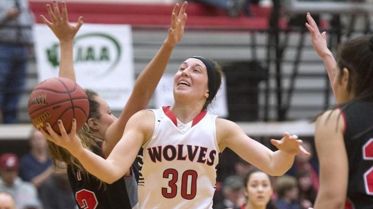 Black Hills point guard Lindsey Nurmi slices to the basket past Archbishop Murphy defender Olivia Riojas during Saturday's 2A Girls Basketball regional playoff game at Saint Martin's University in Lacey on Feb. 25, 2017.