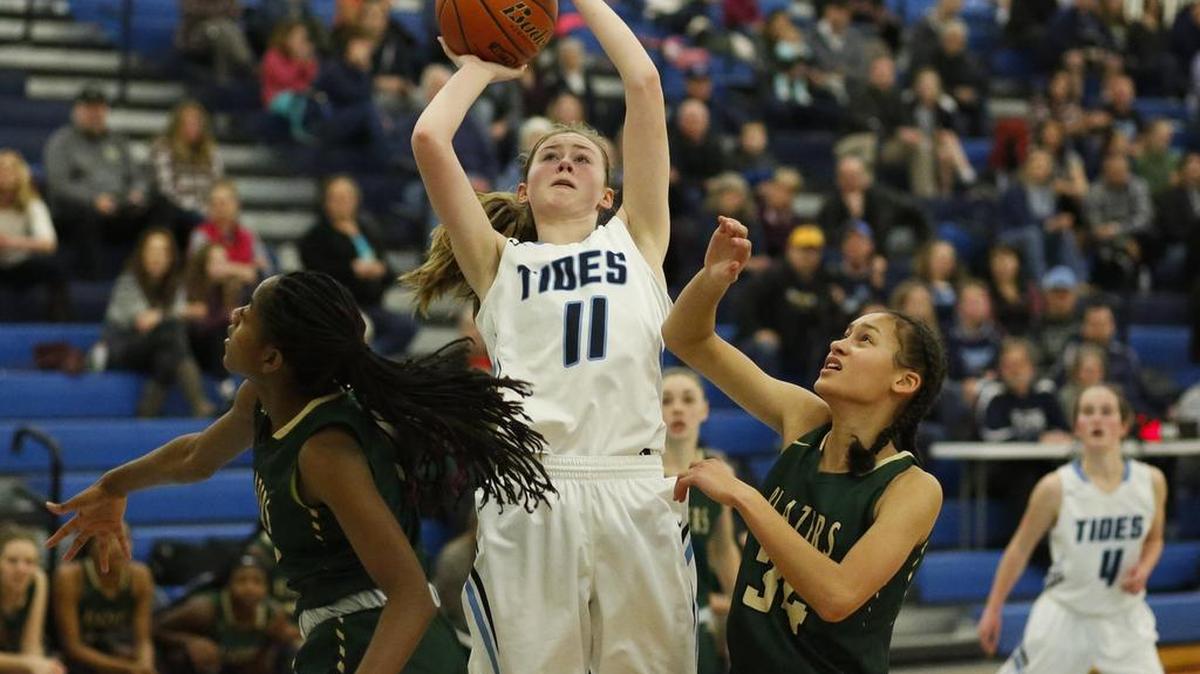 Gig Harbor’s Katie Emery (11) shoots through the defense of Timberline’s Keshara Romain (1) and Arianna Bush (34) in the second quarter. Gig Harbor played Timberline in a basketball game at Gig Harbor, Wash., on Friday, January 27, 2017.