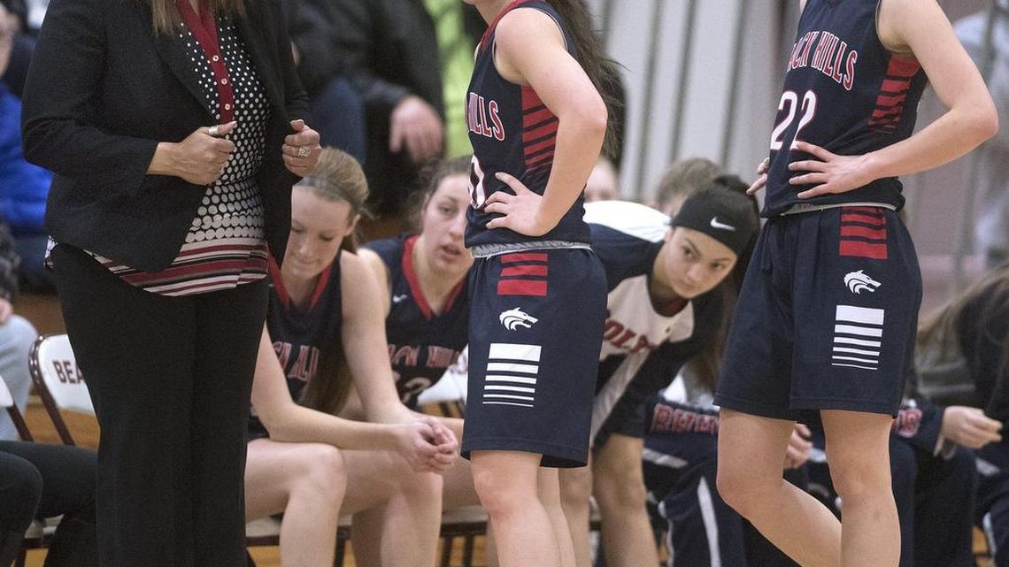 Black Hills coach Tanya Greenfield talks with Lindsey Nurmi, center, and the team’s leading scorer, Emma Duff, during a game this month. “She’s really embraced the role of a point guard,” Greenfield says of Nurmi.