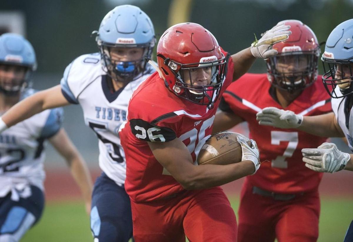Yelm running back James Palmer weaves through the Gig Harbor defense during a football game at Yelm High School on Sept. 21, 2017.