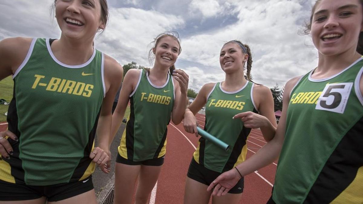 Tumwater 4x200-meter relay runners, from left, Peyton Russell, Sydney Smith, Codi Short and Bella Foos celebrate after running away to a first-place finish at the Chehalis Activator Invite track and field meet at W.F. West High School.