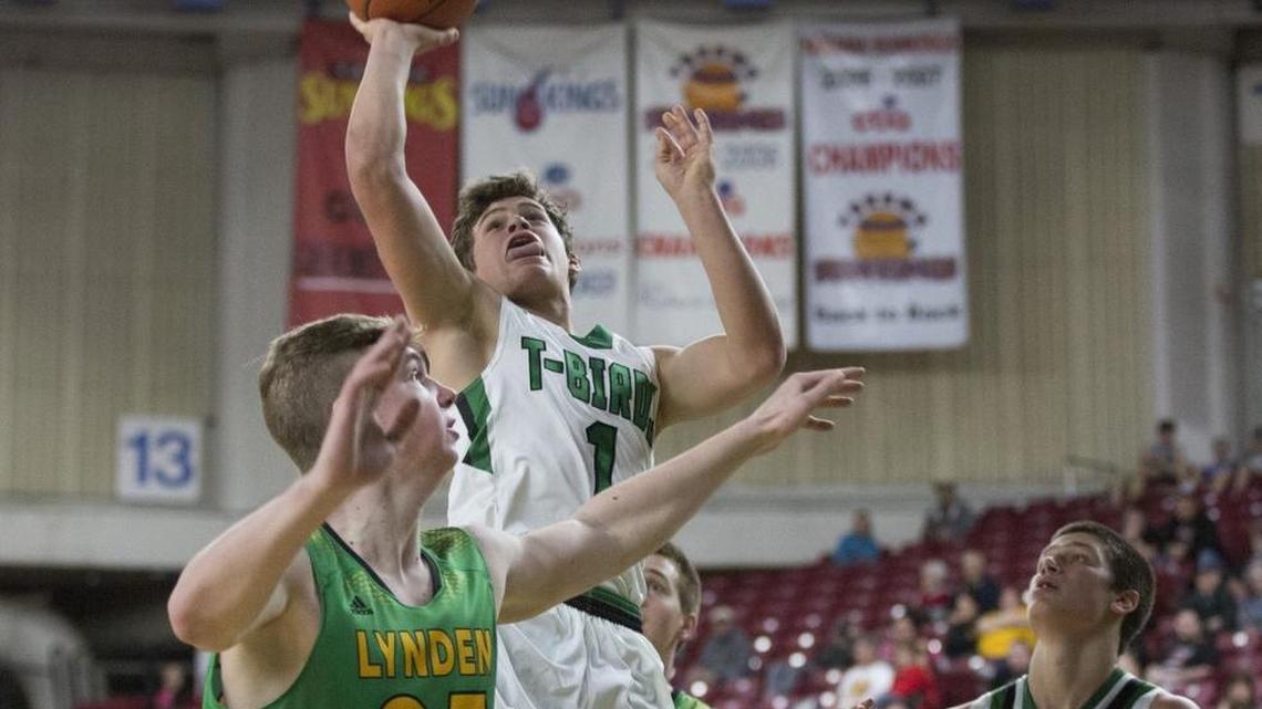 Tumwater’s Brian Marty drives to the basket against Lynden during the 2016 Class 2A consolation game at the Yakima Valley SunDome in Yakima.