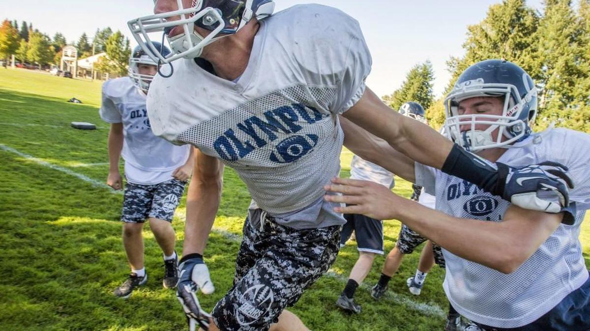 Defensive end Corbin Hartsock, center, will have his hands full Friday night when he matches up against Graham-Kapowsin’s Foster Sarell.