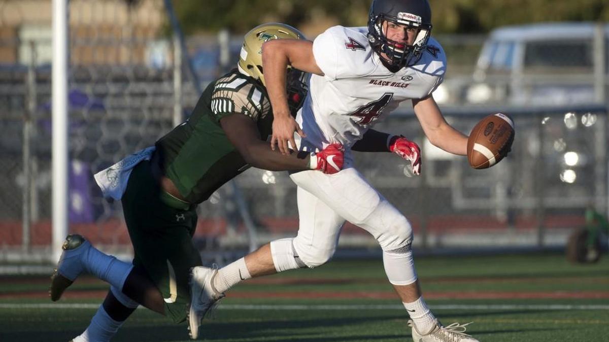 Timberline linebacker Ty Edmond runs down Black Hills quarterback Ethan Loveless for a sack during Thursday night’s season-opening football game at South Sound Stadium in Lacey on Aug. 31, 2017.