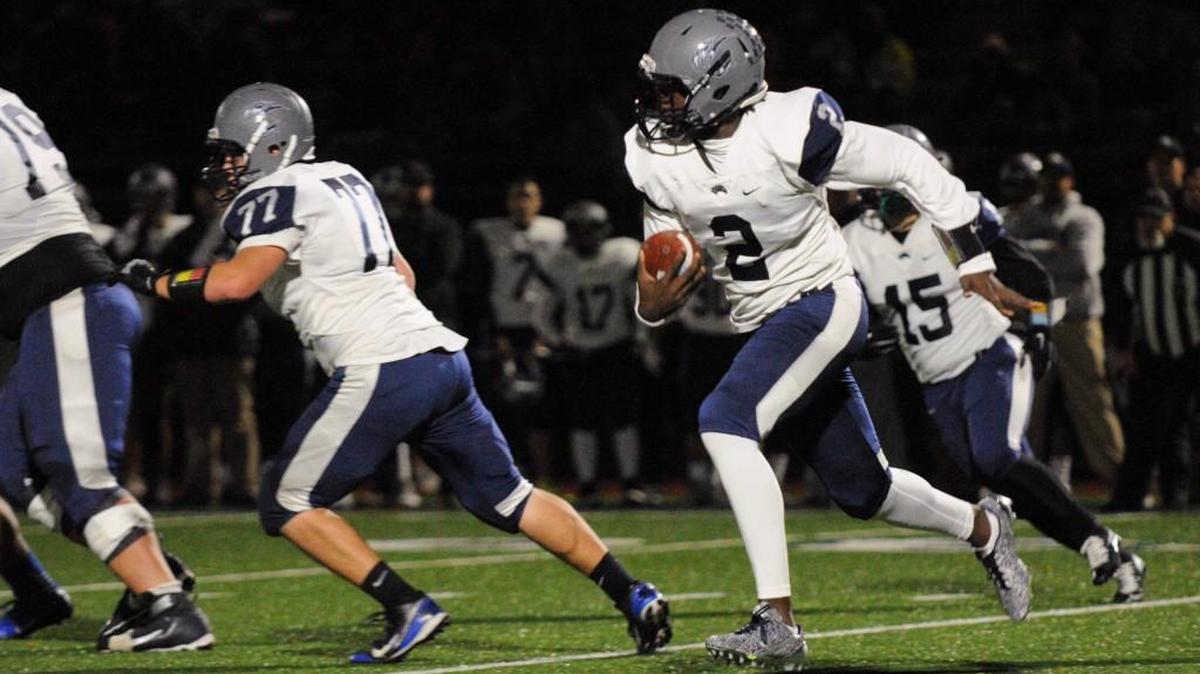 River Ridge quarterback Kelle Sanders scrambles in a Class 2A quarterfinal game on Saturday, Nov. 19 at Liberty High School in Renton.