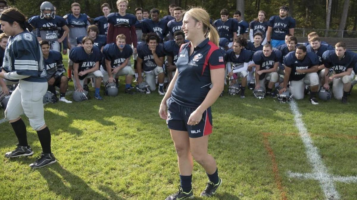 After spending the previous day teaching the safer rugby-style tackling technique to the River Ridge High School football team, Tumwater High graduate and U.S. women’s national team player Kelsie Stockert stops by the Hawks’ practice in Lacey.