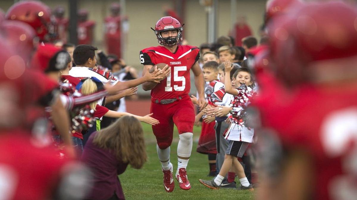 Yelm junior quarterback Kyle Robinson enters the field for last Friday night's 3A SSC football game against Gig Harbor at Yelm High School on Sept. 21, 2017.