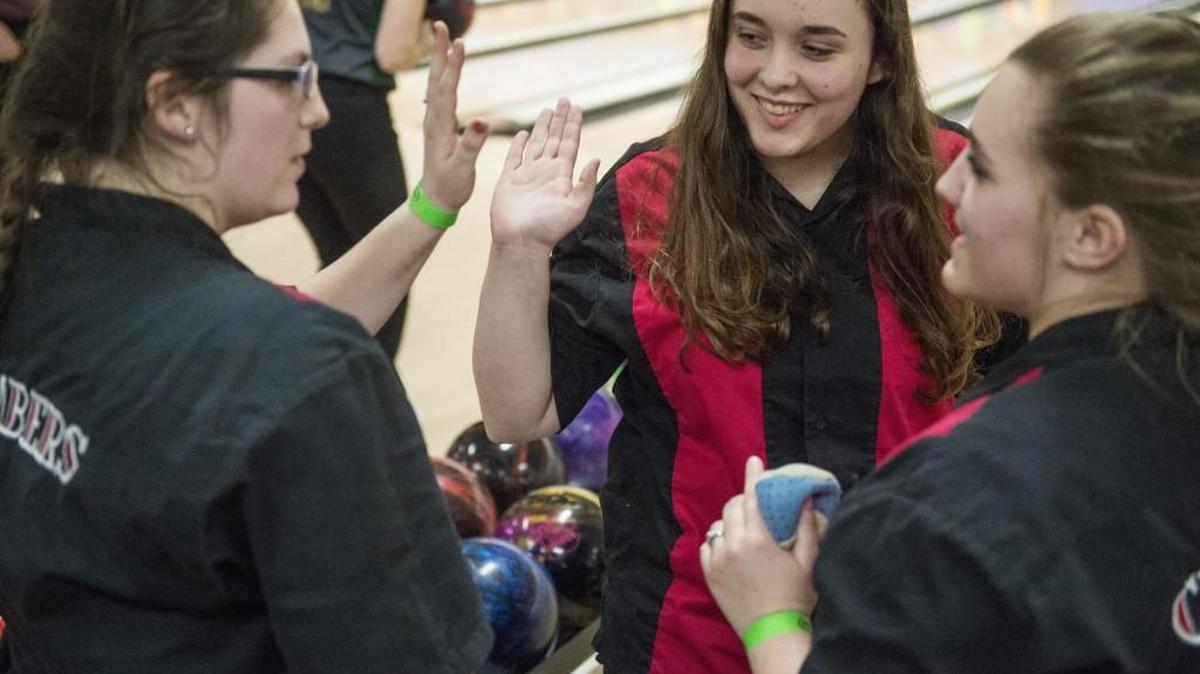 Shelton's Kaylee Alone celebrates after bowling a strike during the State Girls Bowling Championships at Narrows Plaza Bowl in Tacoma on Friday, Feb. 2, 2018.