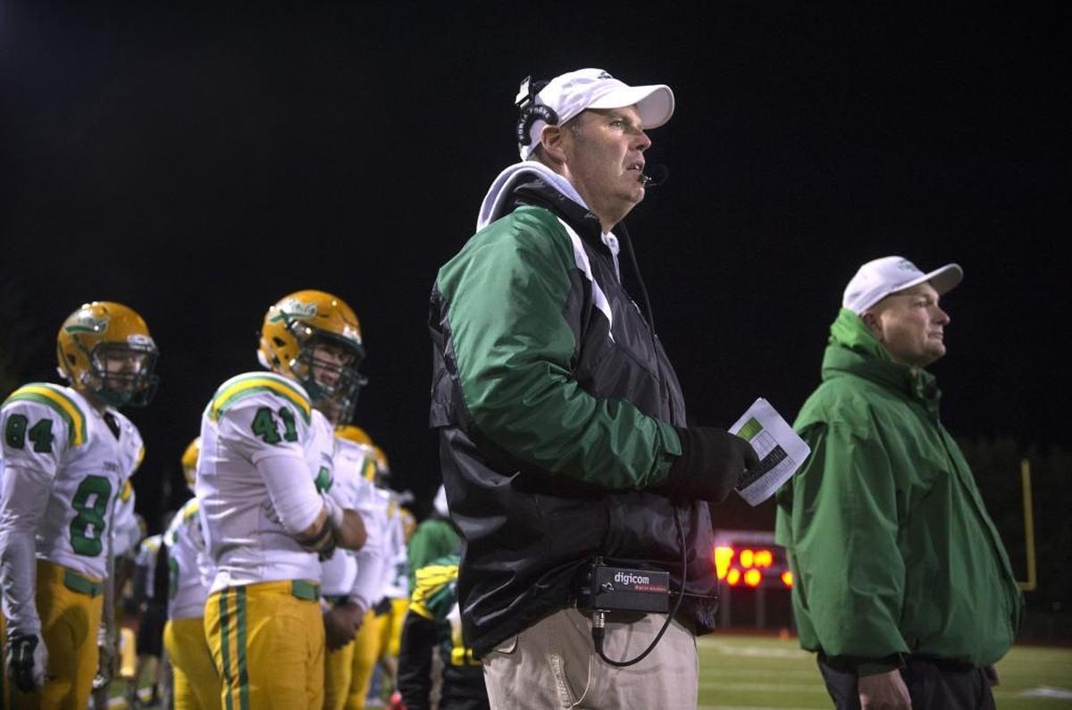Tumwater High School coach Bill Beattie and assistant coach Rick McGrath (right) watch action from the sideline during the annual Pioneer Bowl rivalry game against Black Hills at Tumwater District Stadium in October.