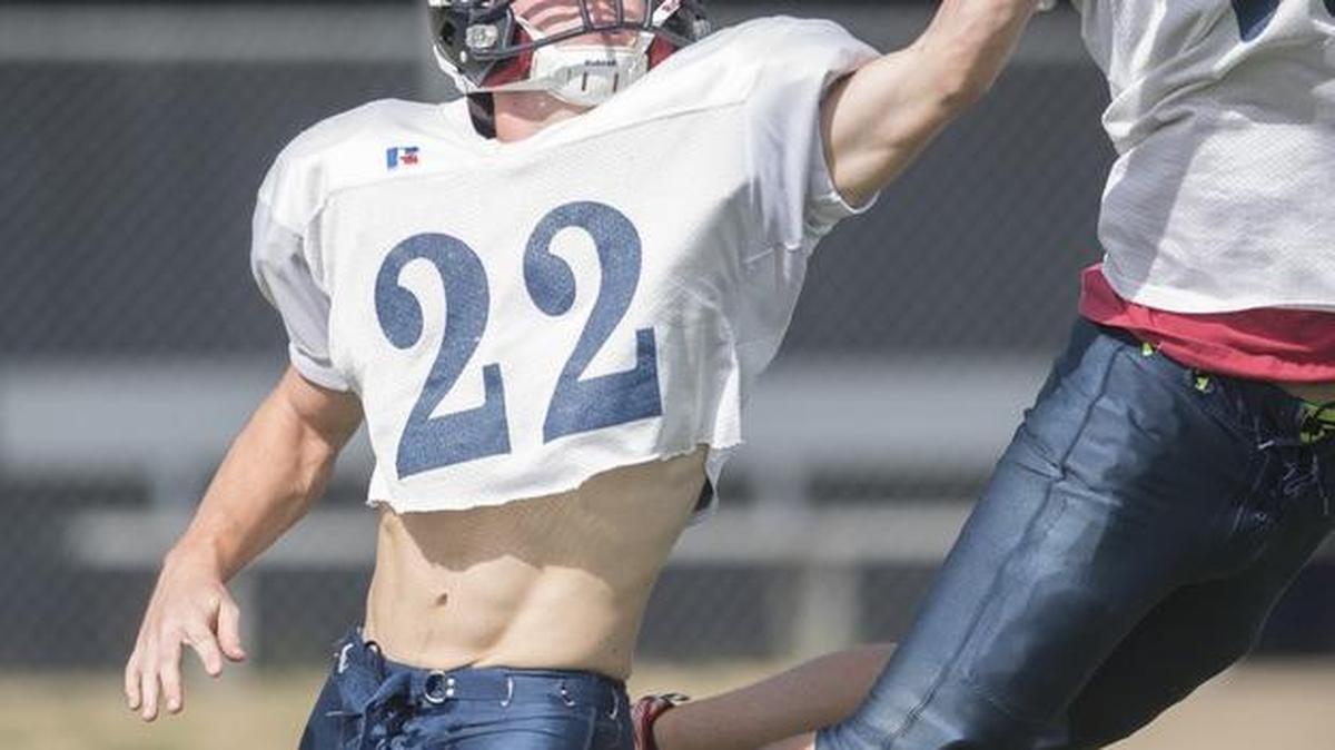 
Black Hills senior linebacker Cameron Berndson (22) defends against a pass to junior Justin Gudaz during football practice Thursday at Black Hills High School in Tumwater.
