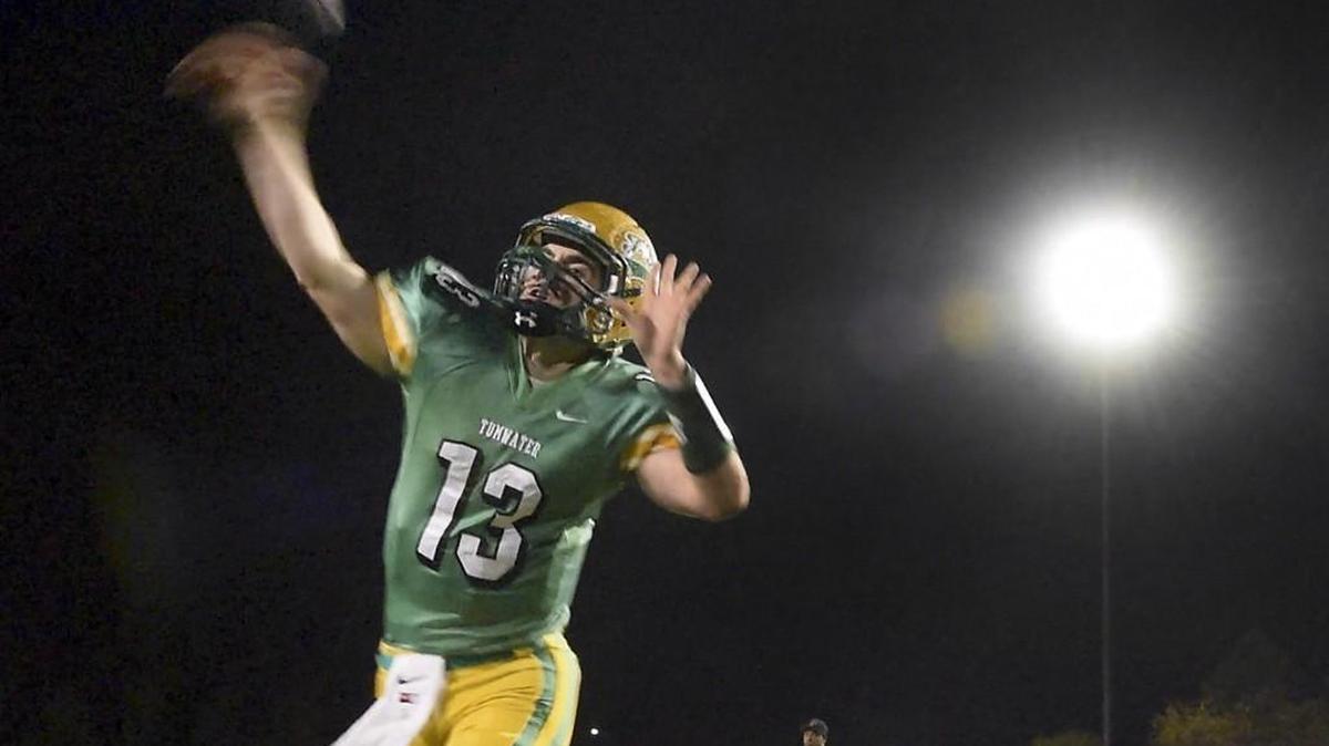 Tumwater quarterback Spencer Dowers warms up before the T-Birds' 2A football state playoff game against the Franklin Pierce Cardinals at Tumwater District Stadium on Friday, Nov. 13, 2015.