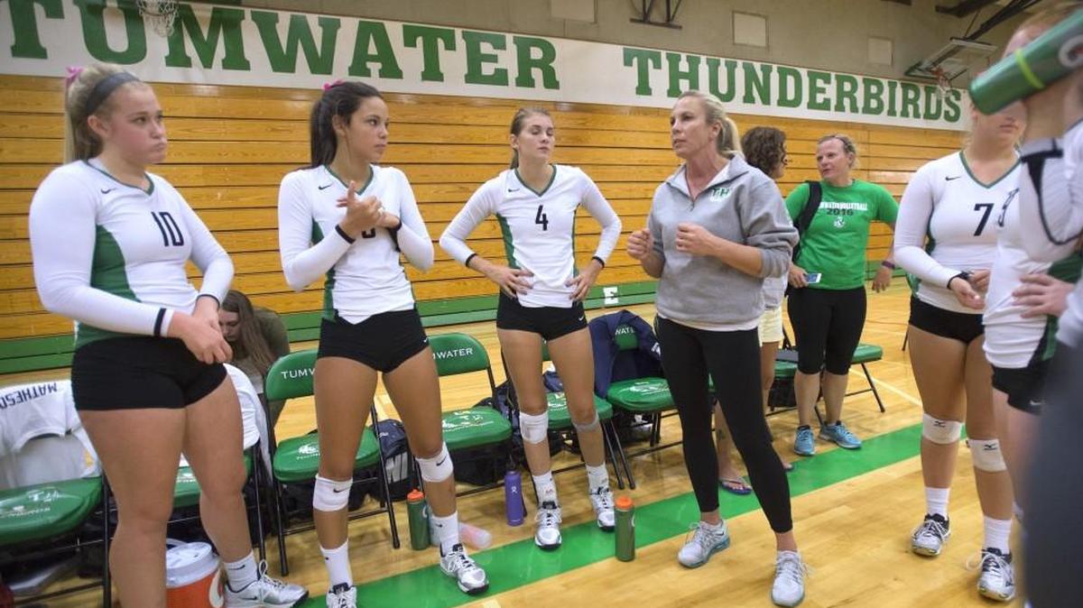 Tumwater coach Tana Otton directs the T-Birds in a timeout during a volleyball match against Olympia at Tumwater High School on Sept. 15, 2016.