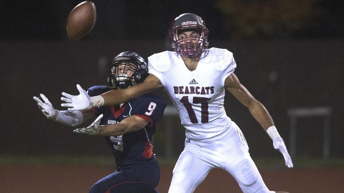 Black Hills wide receiver Kade Weitzel (9) battles W.F. West defensive back Jordan Thomas for a pass during Friday night’s football game at Tumwater District Stadium on Oct. 13, 2017.
