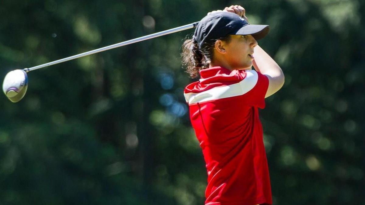 Nya Kabouni, a freshman at Yelm High School, tees off on the second hole during the golf match at Lake Spanaway Golf Course in Spanaway, on Tuesday, May 10, 2016.