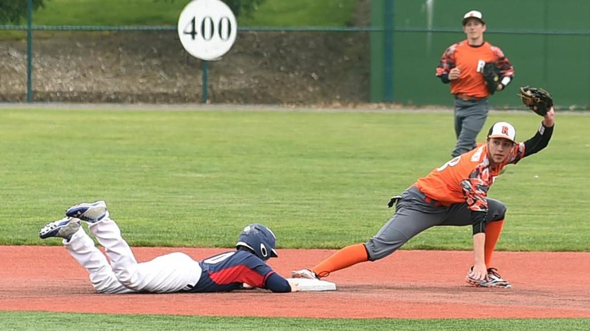 Rainier infielder Zach Lofgren looks to the umpire for the tag call on Nate Jensen and gets the out. The Mountaineers clinched the 2B Pacific title with the doubleheader sweep Tuesday and will host the District 4 tournament opener.